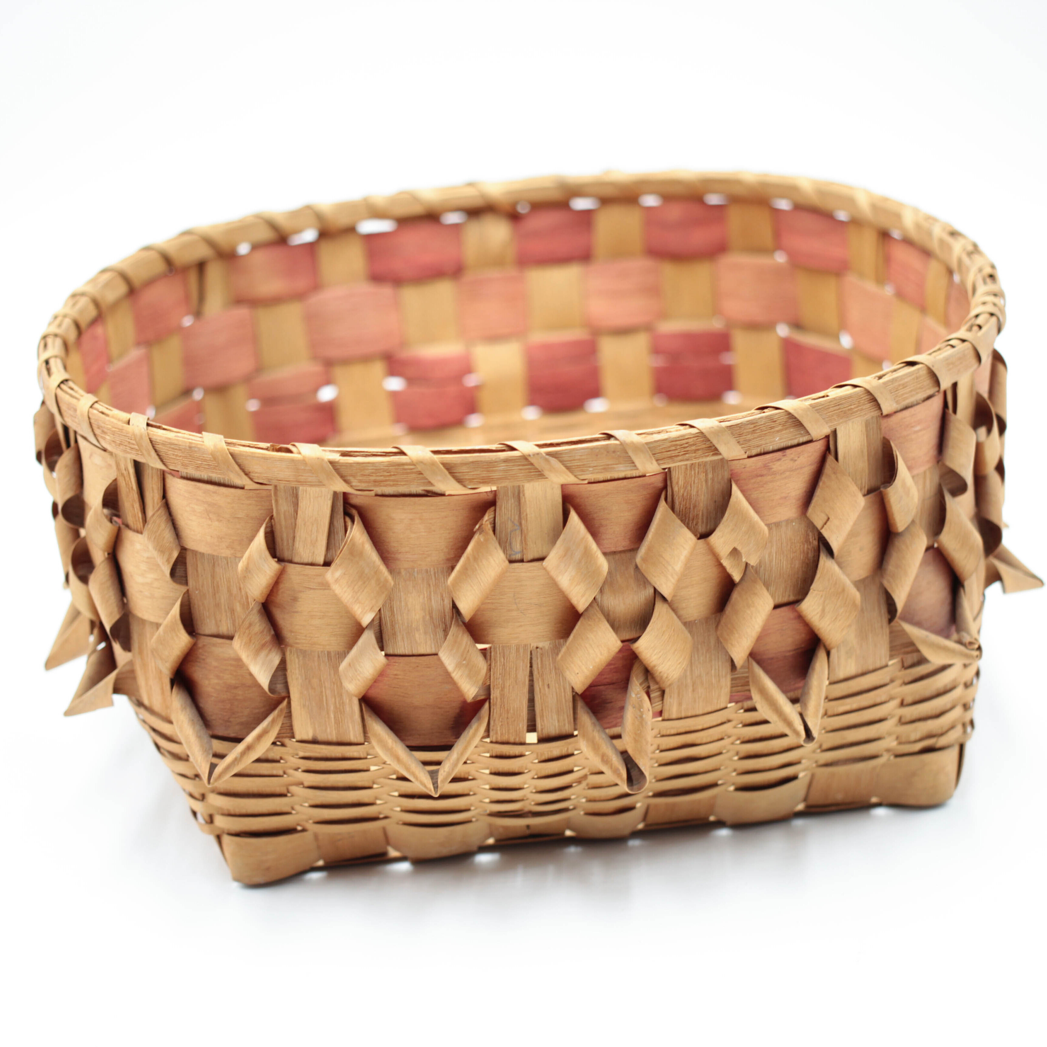 woven basket with red highlights