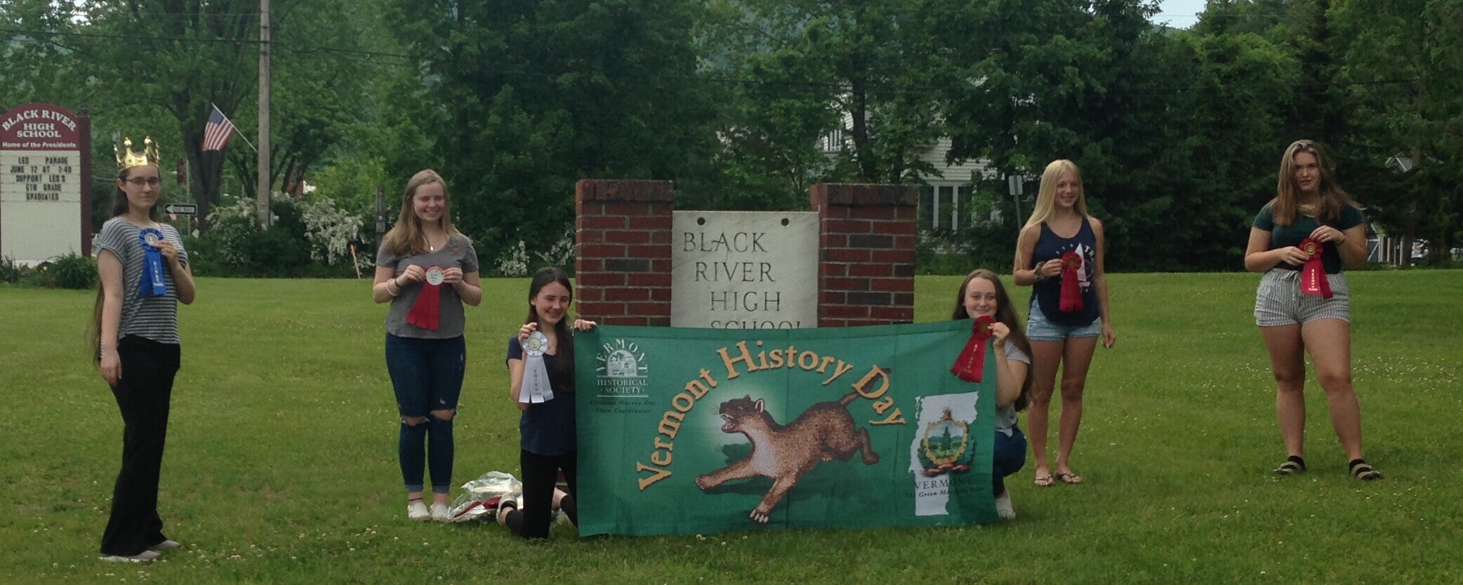 six students holding ribbons and the Vermont History Day banner
