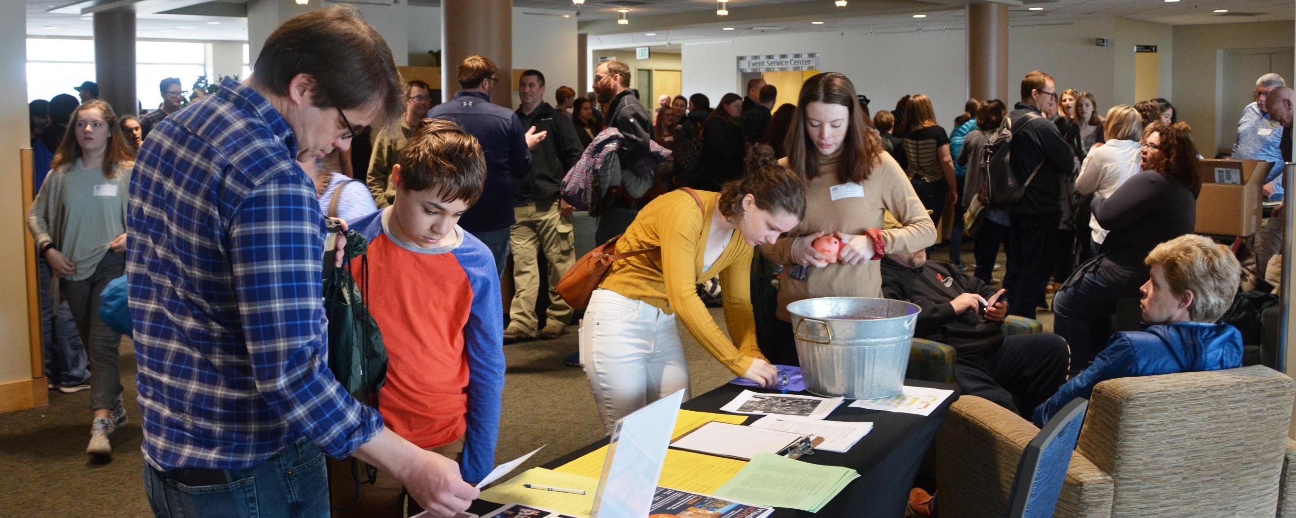 crowd of people near registration desk at Vermont History Day 2019