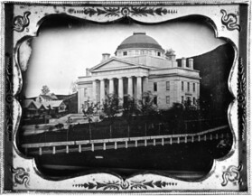 old photo of building with columns and dome
