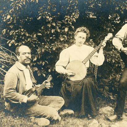 Man playing ukulele and woman playing banjo