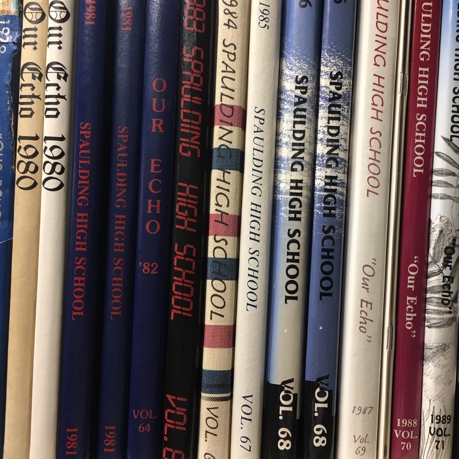 Photo of spines of Spaulding High School yearbooks.