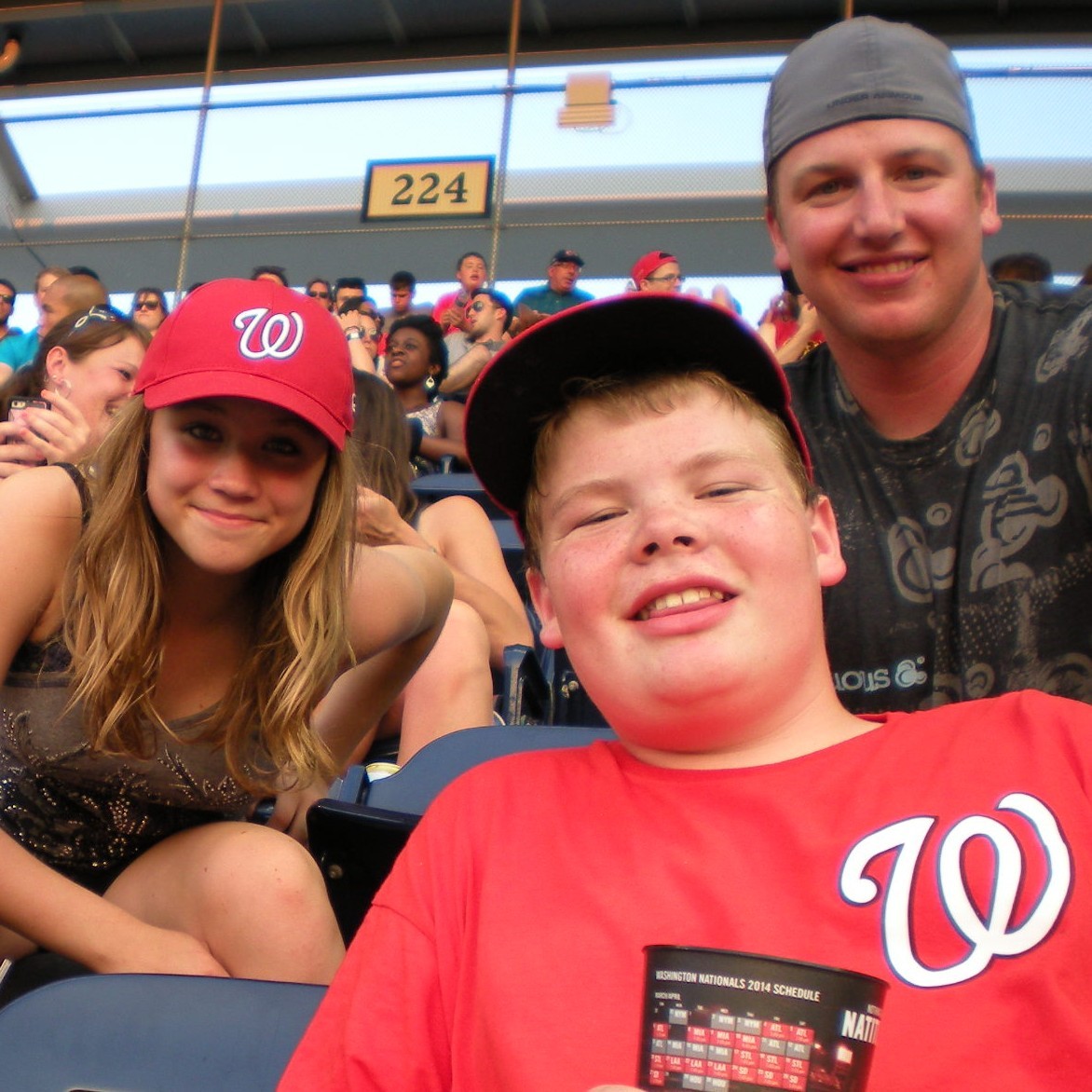 two students and teacher at Nationals Baseball game during National History Day 2014