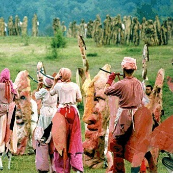 people dancing in costume in field
