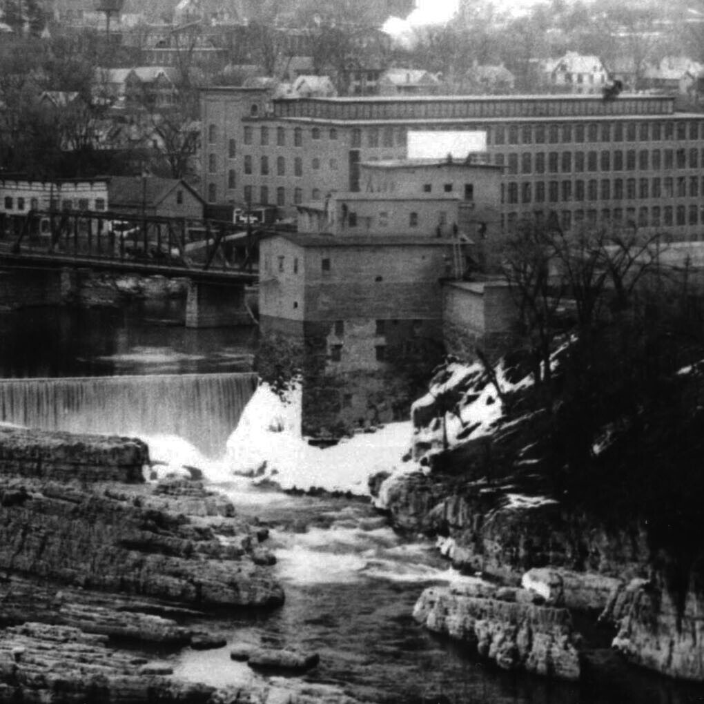 old photo of mill by river