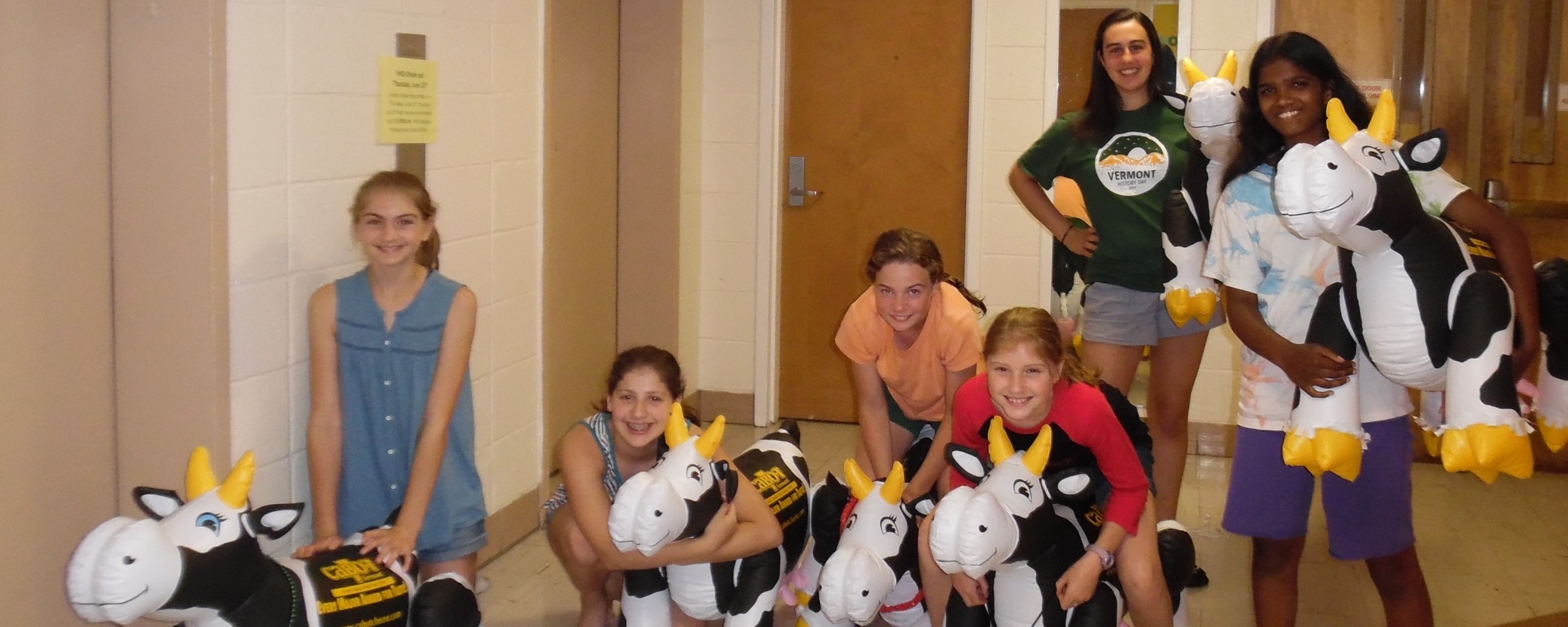 group of students in the dorm with inflatable cows at National History Day 2017