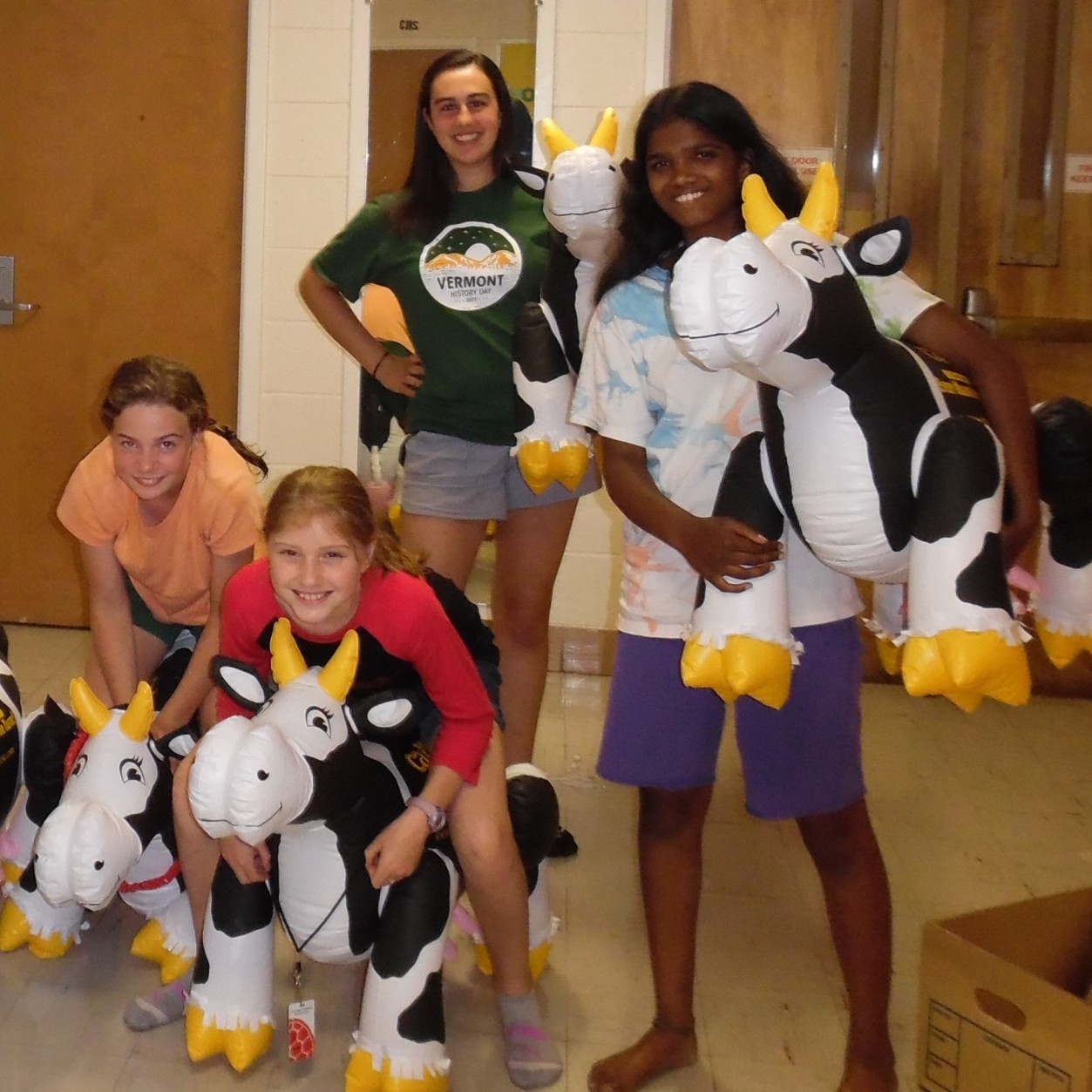 four students with inflatable cows at National History Day 2017