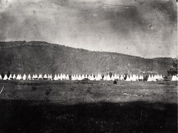 old photo of tents in soldier's camp