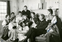 Von Trapp family sitting on couch