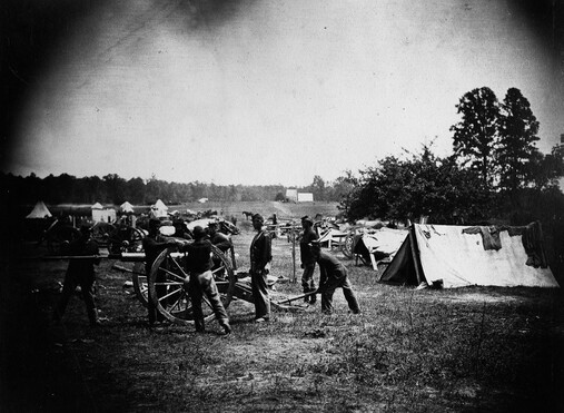 Civil War soldiers practicing with cannon