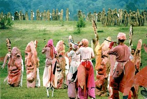 people in costume dancing in field