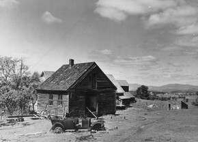 old photo of abandoned farm and car