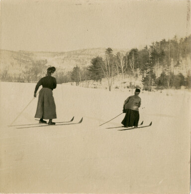 old photo of two women skiing