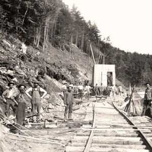 old photo of men laying railroad tracks