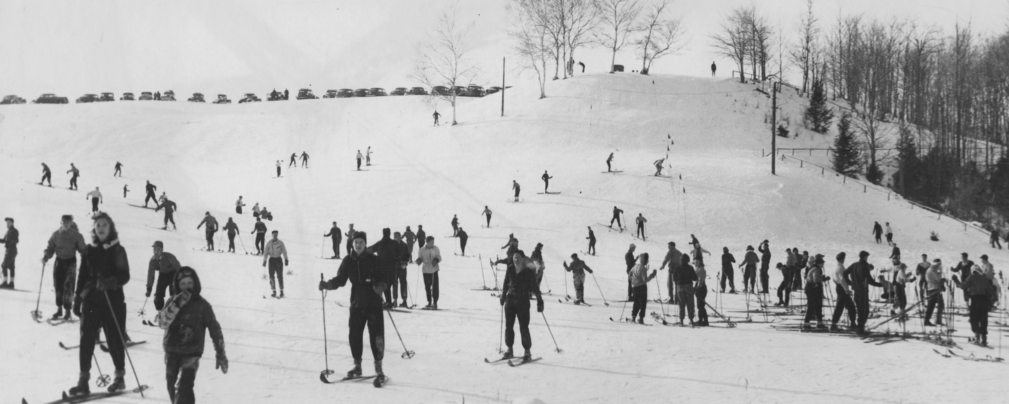 old photo of many people skiing